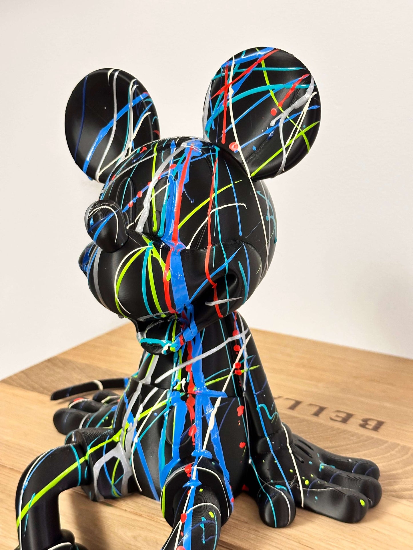 Mickey Mouse Pop Art statue in black with colorful splashes, 3D printed, unique design for home decor.