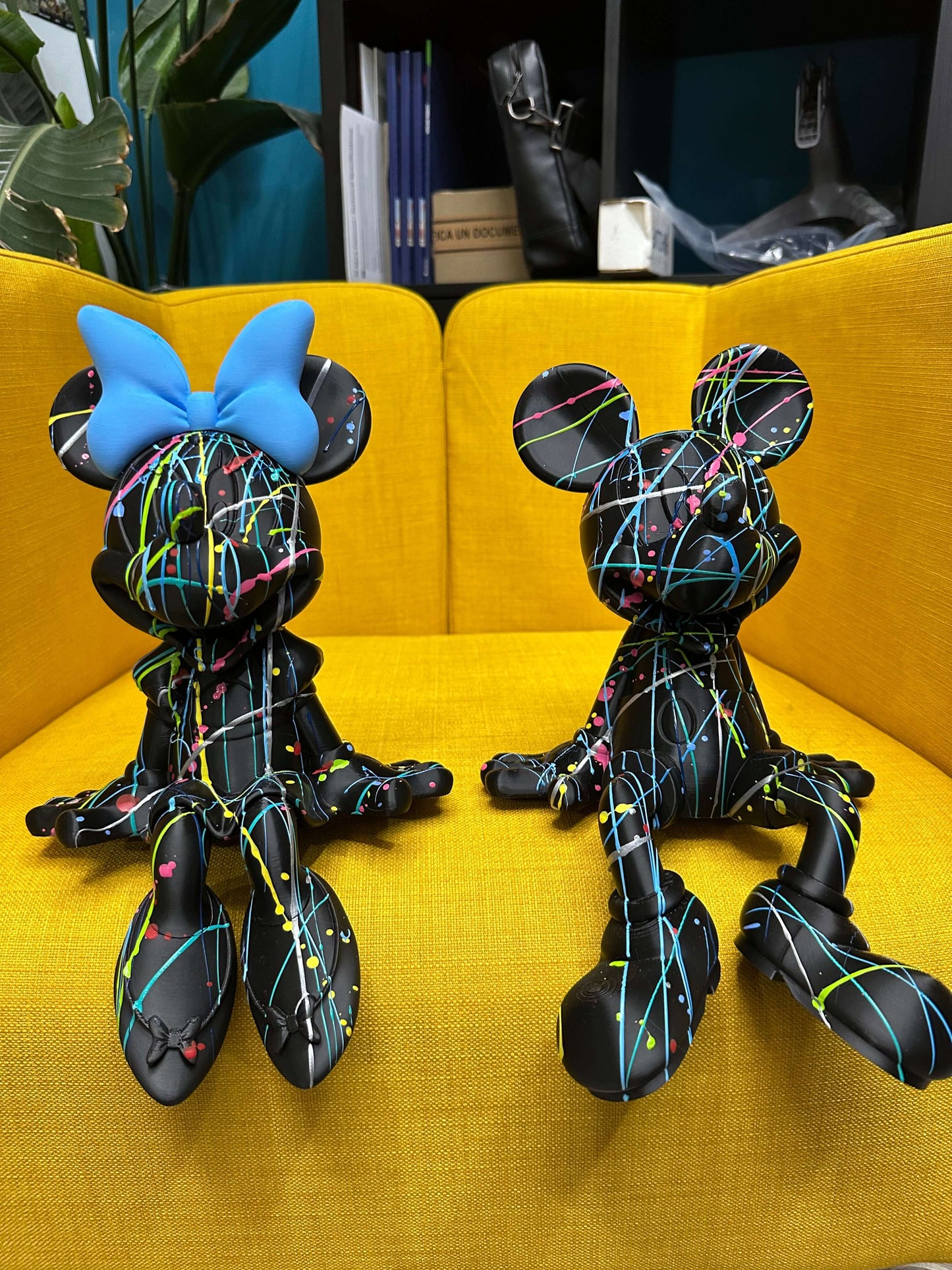 Minnie and Mickey Mouse pop art figures with colorful splatter design, perfect for contemporary interior design.
