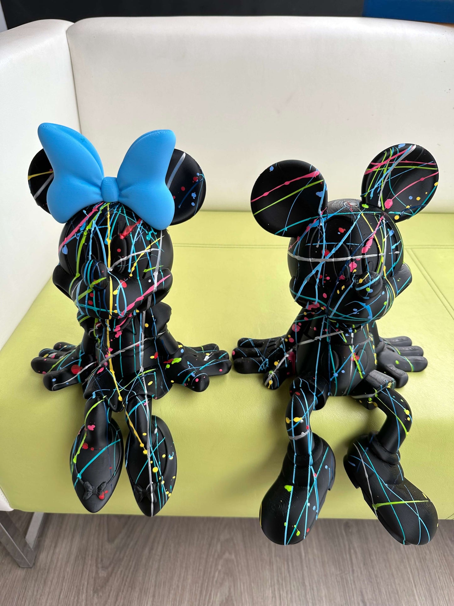 Minnie Mouse Pop Art statue, handcrafted in 3D PLA, featuring vibrant paint splatter design for cool interior decor.